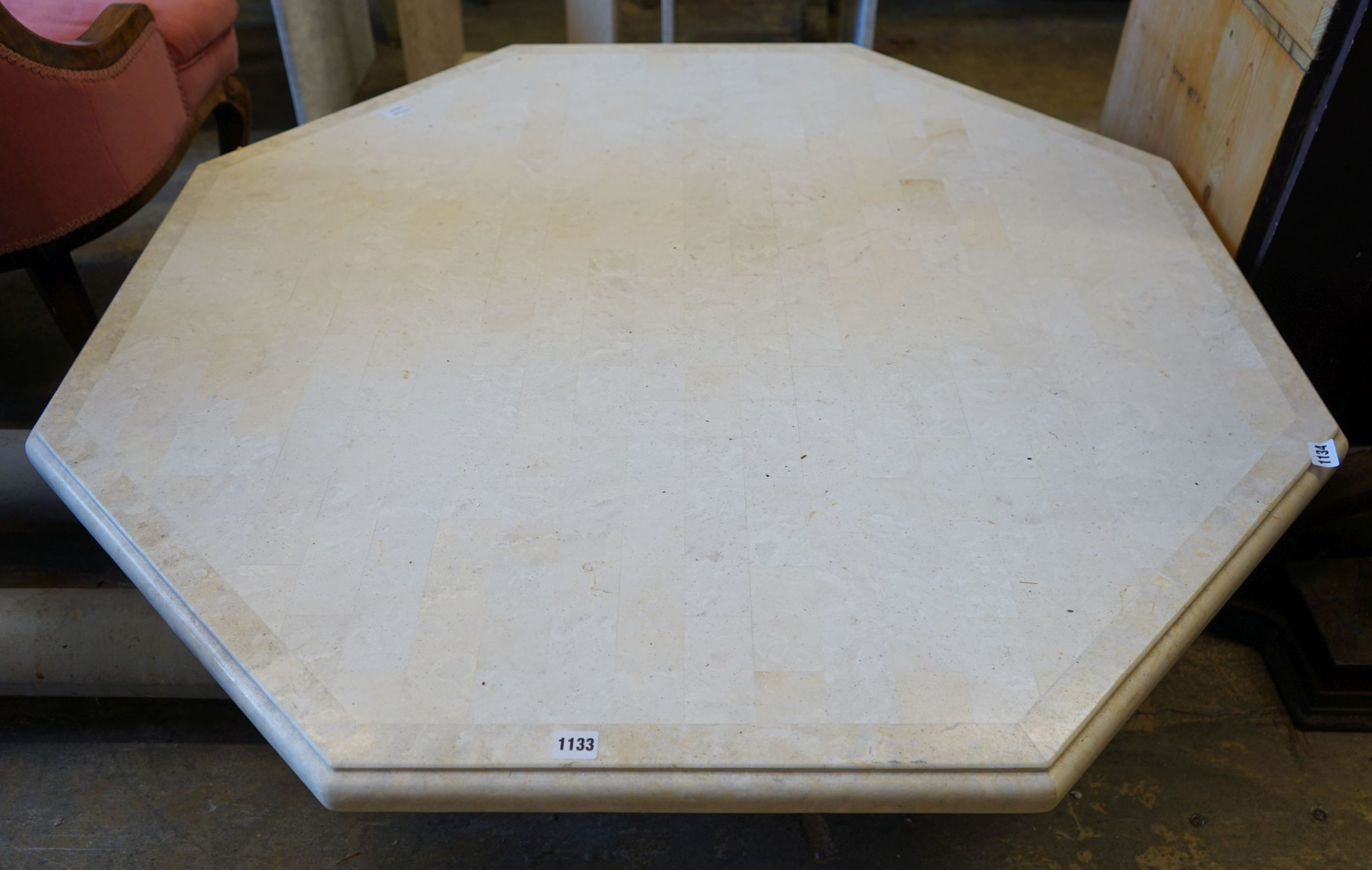 A large contemporary octagonal reconstituted marble coffee table, width 120cm height 38cm